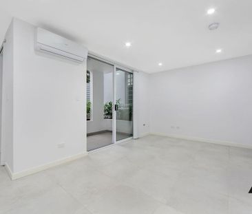 Modern Masterpiece – Split Level Two Bedroom Townhouse Style Apartm... - Photo 2