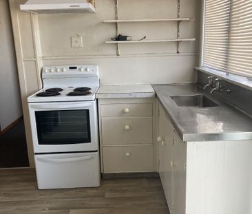 This tidy upstairs one-bedroom flat is located in the popular and c... - Photo 1