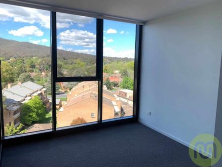 Sophisticated Living in the Prestigious Metropol Building: 2 Bed, 2 Bath, 1 Car - Photo 2