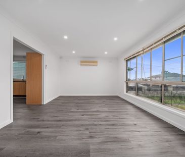 Freshly Updated Family Home with Generous Yard & Garage - Photo 1