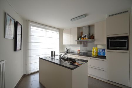 Knap appartement met twee slaapkamers, twee terrassen en standplaats in Hoeselt centrum - Photo 5