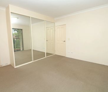SPACIOUS & WELL POSITIONED 2-BEDROOM APARTMENT! - Photo 1