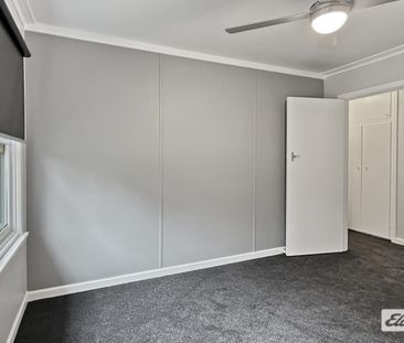 A beautifully renovated four-bedroom home - Photo 4