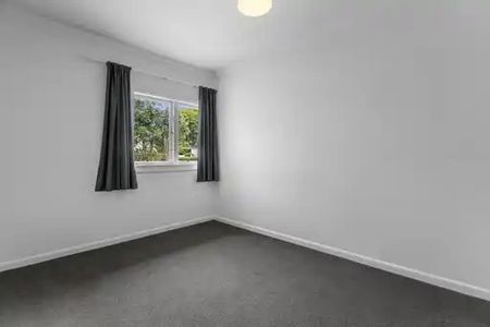 This beautifully presented three-bedroom, two-bathroom home offers a premium standard of living in one of the most desirable locations near the city. - Photo 2