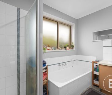 PRACTICAL THREE-BEDROOM BRICK HOME WITH REAR ACCESS - Photo 2