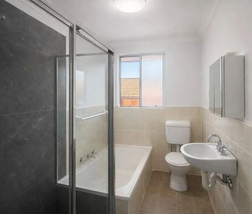 Quiet Top-Floor Living in a Convenient Location - Photo 4