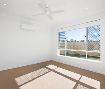 Spacious 4-Bedroom Home in the Heart of Redbank Plains! - Photo 1