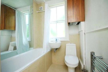 A modern top floor, two bedroom apartment in a well maintained terraced building. - Photo 5
