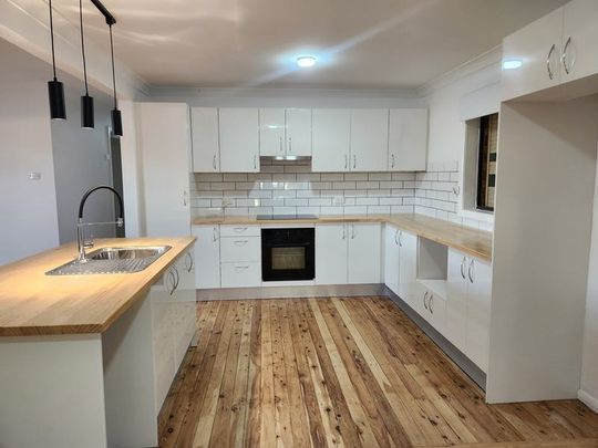 STYLISH FAMILY HOME READY TO MOVE IN - Photo 1