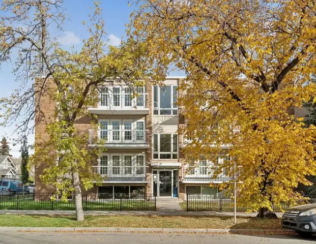 Charming 2 bedroom condo on idyllic tree-lined street in Sunalta | 101 - 1534 15 Avenue Southwest, Calgary - Photo 1