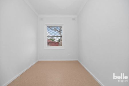 Comfortable 3-Bedroom Home with Spacious Yard in a Convenient Location - Photo 2