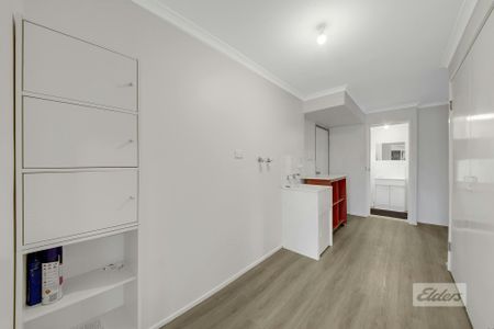 THIS PROPERTY OFFERS LOW MAINTENANCE LIVING WITH A SPACIOUS YARD , PRACTICAL LAYOUT AND SOLAR! - Photo 2