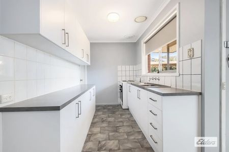 Charming 3-Bedroom Home with Modern Comforts & Outdoor Storage - Photo 4