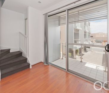 Open the Door to City Serenity with a Private Balcony - Photo 3