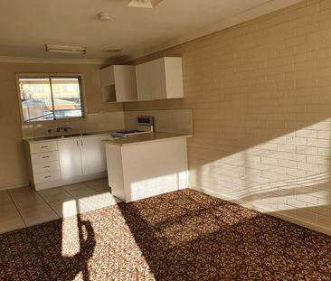 CENTRAL LOCATION THIS TIDY RESIDENTIAL FLAT WITH ITS OWN CARPORT - Photo 3