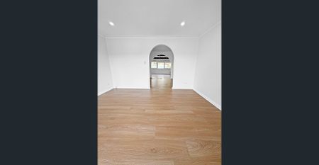 Renovated 3-Bedroom Home with Double Garage & Multiple Living Areas - Photo 2