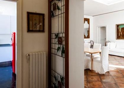 Attic-Monti: Spacious, furnished 3 Bedroom, 2 bath, living room, dining room, study and large panoramic terrace. Bright, silent, located in well kept Palazzo d’Epoca with elevator and doorman. Near transport and Metro.