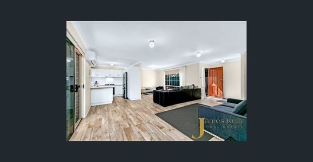 Spacious and Secure Home with Stunning Entertaining Deck ! - Photo 1