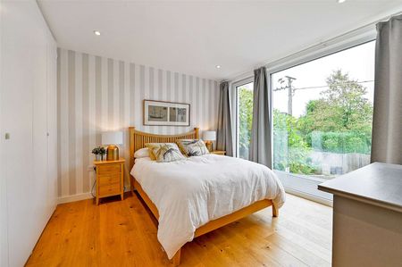 Situated by the water's edge this modern and detached family home boasts exceptional energy efficiency and views of Old Windsor Lock. - Photo 5