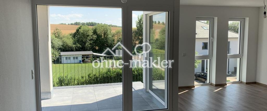 Neubau: 3-Zimmer-Wohnung mit Garten & Balkon, tollem Ausblick und EBK in Feldrandlage! A+ - Foto 1