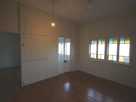 A SPACIOUS HIGH-SET HOME WITH 2 BEDROOMS PLUS ENCLOSED VERANDAS. - Photo 3