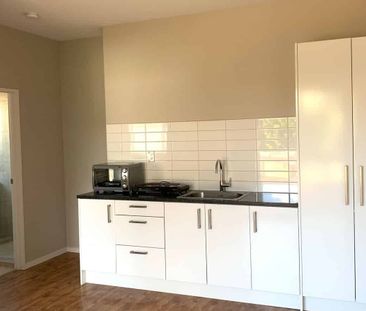 ALL UTILITIES INCLUDED - One Bedroom Unit with Off-Street Parking - Photo 1