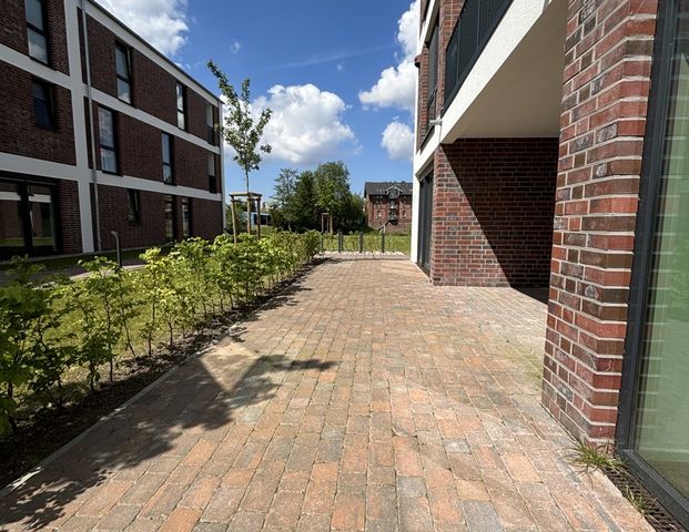 Sonnige Erdgeschosswohnung am Norder Tor mit großer Terrasse zur Miete! - Foto 1