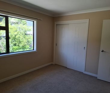 Discover comfort and convenience in this four-bedroom, two-bathroom... - Photo 3