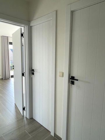 Gerenoveerd 2-kamerduplexappartement met overdekte autostaanplaats - Photo 4