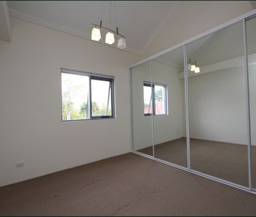 Spacious Two Bedroom Townhouse with Three Car Garage - Photo 5