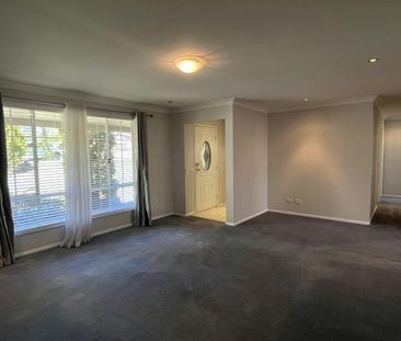 Bright Family Home with Sunroom and Outdoor Living Space - Photo 1