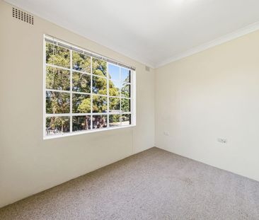 Sunlit Full-Brick Apartment with Quiet Outlook, Pool Access & Walk-... - Photo 2