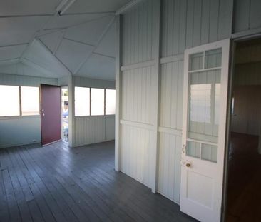 A SPACIOUS HIGH-SET HOME WITH 2 BEDROOMS PLUS ENCLOSED VERANDAS. - Photo 1