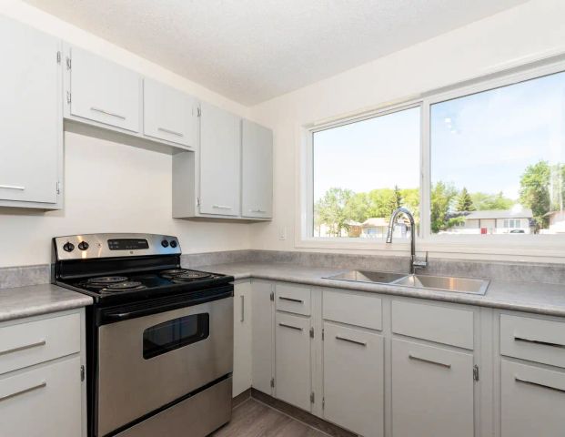 Eastside Estates — 3 Bedroom Townhouse - Photo 1