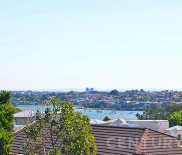 Elevated Luxury with Soaring Ceilings & Water Views - Photo 6