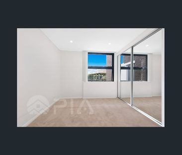 SPACIOUS TWO BEDROOM APARTMENT WITH LARGE COVERED BALCONY - Photo 2