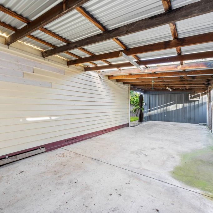 Four-Bedroom Family Home with Dual Driveways and Shedding - Photo 1