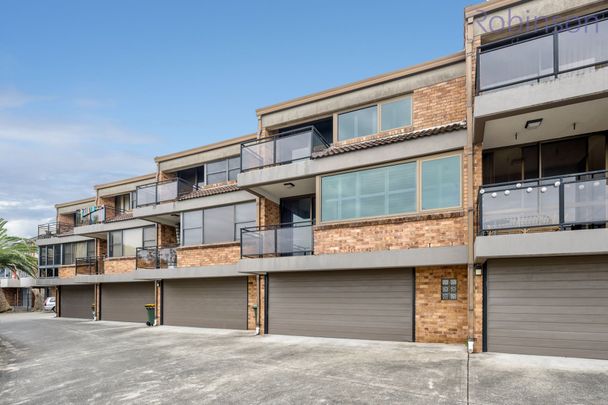 Larger than average, air-conditioned townhouse with district views and a double garage. - Photo 1