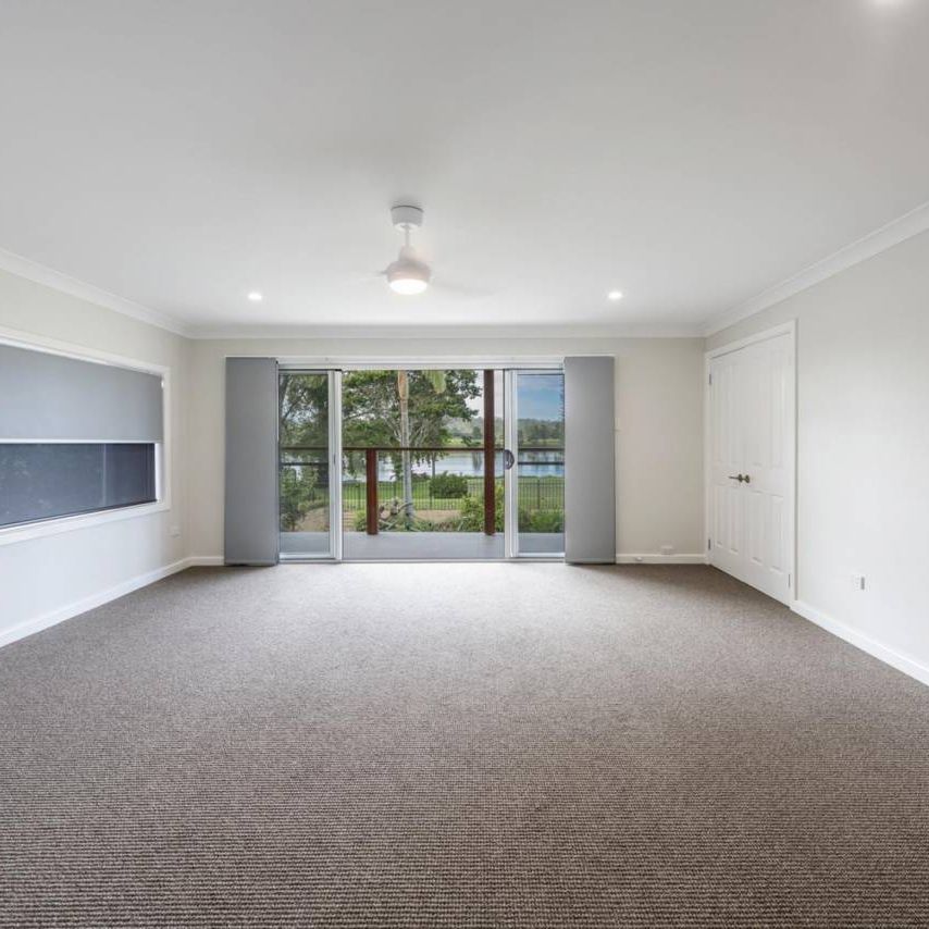 RENOVATED EXECUTIVE RIVERFRONT HOME - Photo 1