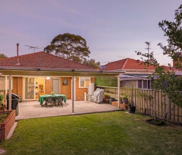 Stylishly updated north-to-rear facing home set on a tree-lined street - Photo 2