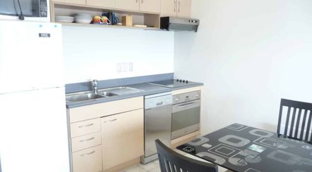 North facing apartment with a balcony and two garage parking spaces. - Photo 2