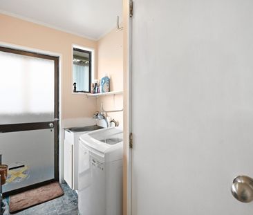 This freshly renovated three-bedroom home offers modern comfort wit... - Photo 1