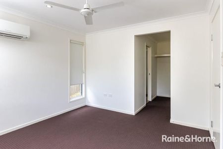 MODERN FOUR BEDROOM AIR CONDITIONED HOME IN SOUTH GLADSTONE! - Photo 5