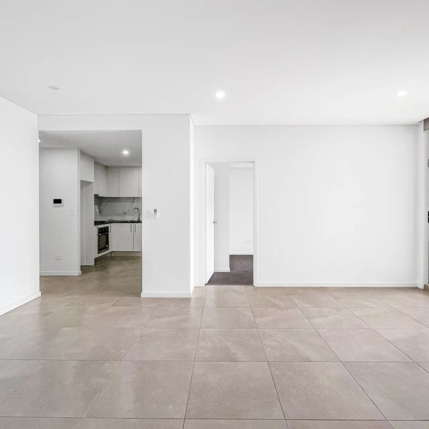 Stylish Two Bedroom Unit with Modern Kitchen, Ensuite, and Oversized Balcony in Prime Location - Photo 1