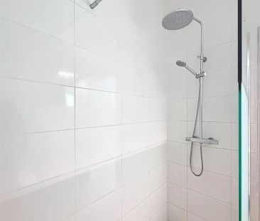 Uitzonderlijk groot gelijkvloers appartement met stadstuin en garage - Photo 3