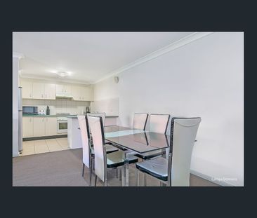 Modern two-bedroom top floor unit in prime location - Photo 2