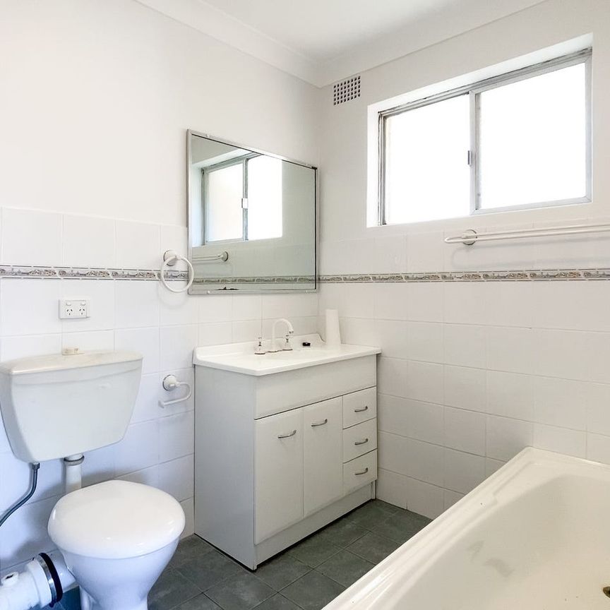 Top-Floor Two-Bedroom Unit Moments from the Beach - Photo 1