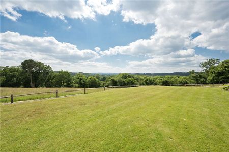 An extensively refurbished five bedroom country house with an indoor pool and tennis court in south Farnham under 2 miles from the centre of Farnham town. - Photo 3