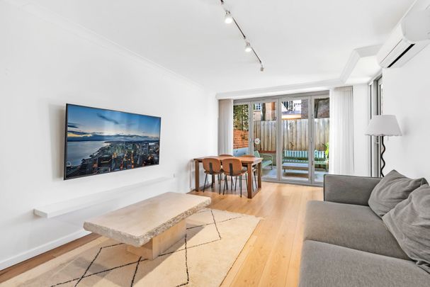 Spacious Apartment with Large Courtyard in the Heart of Kensington! - Photo 1