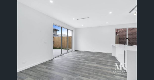 Experience Modern Elegance in This Brand New Home - Photo 1
